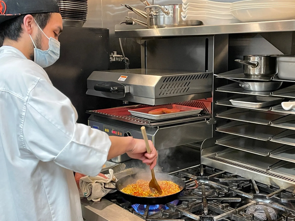Equipex finishing oven with chef cooking
